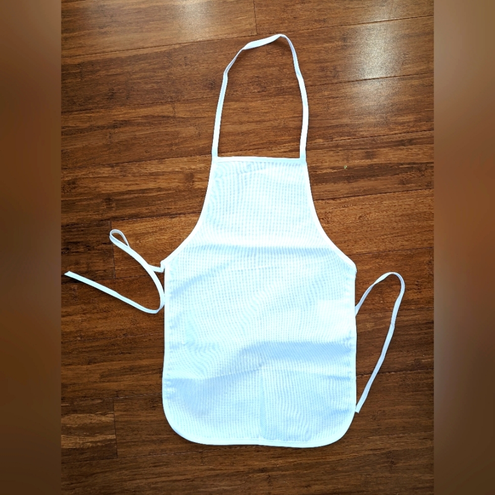 4 pack. Kids size aprons. 1 little baker, 3 blank. Brand new. Cotton material
